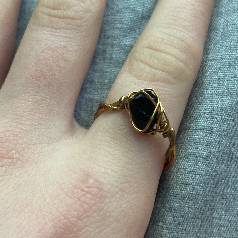Elegant Gold and Black Ring